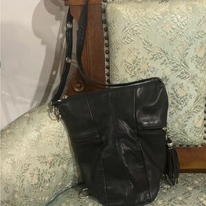 Tignanello Black Bucket Bag with Sleek Design and Adjustable Strap